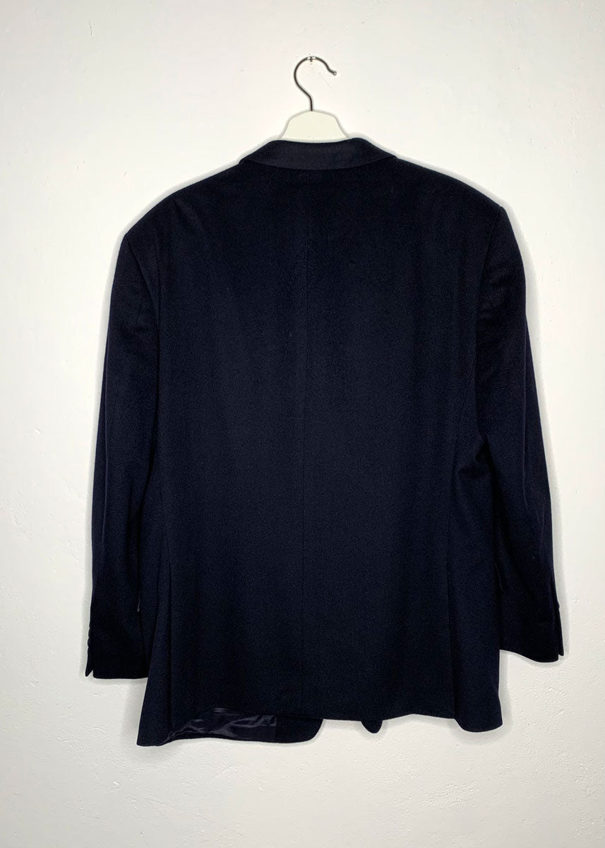 Blazer hanging on hanger from the back.