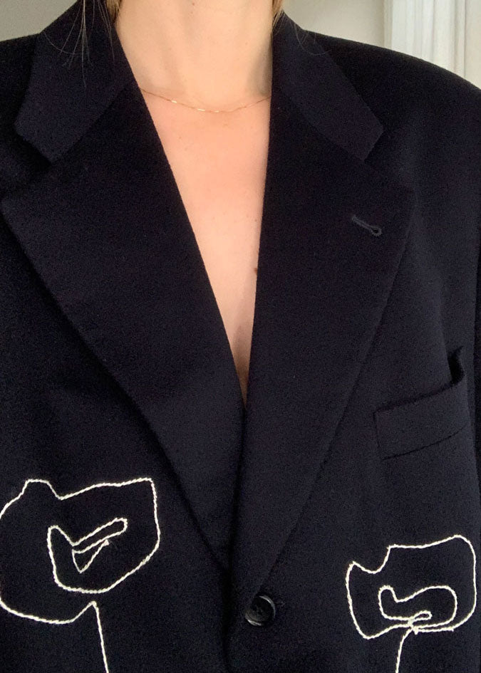 Close-up of front of worn blazer.