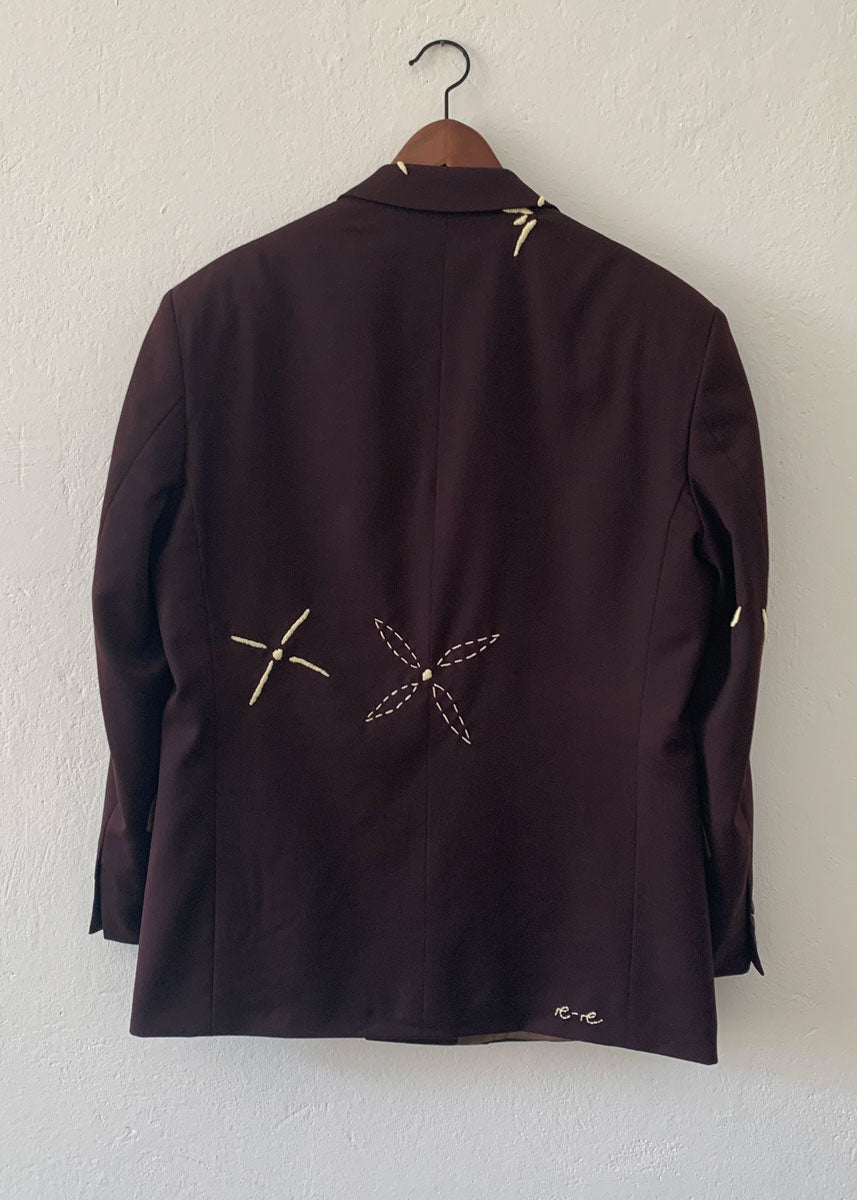 same blazer from the back featuring hand-embroidery