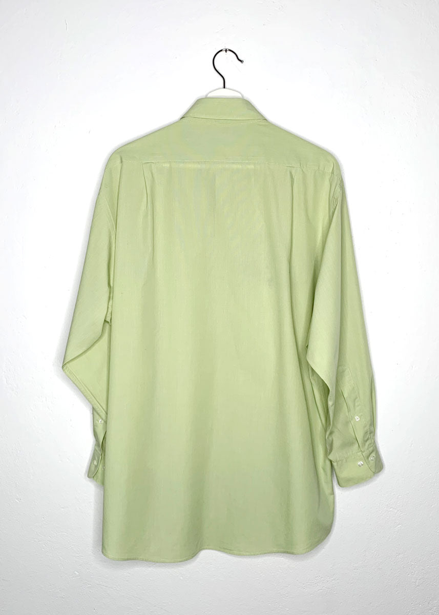 Shirt on hanger from back.