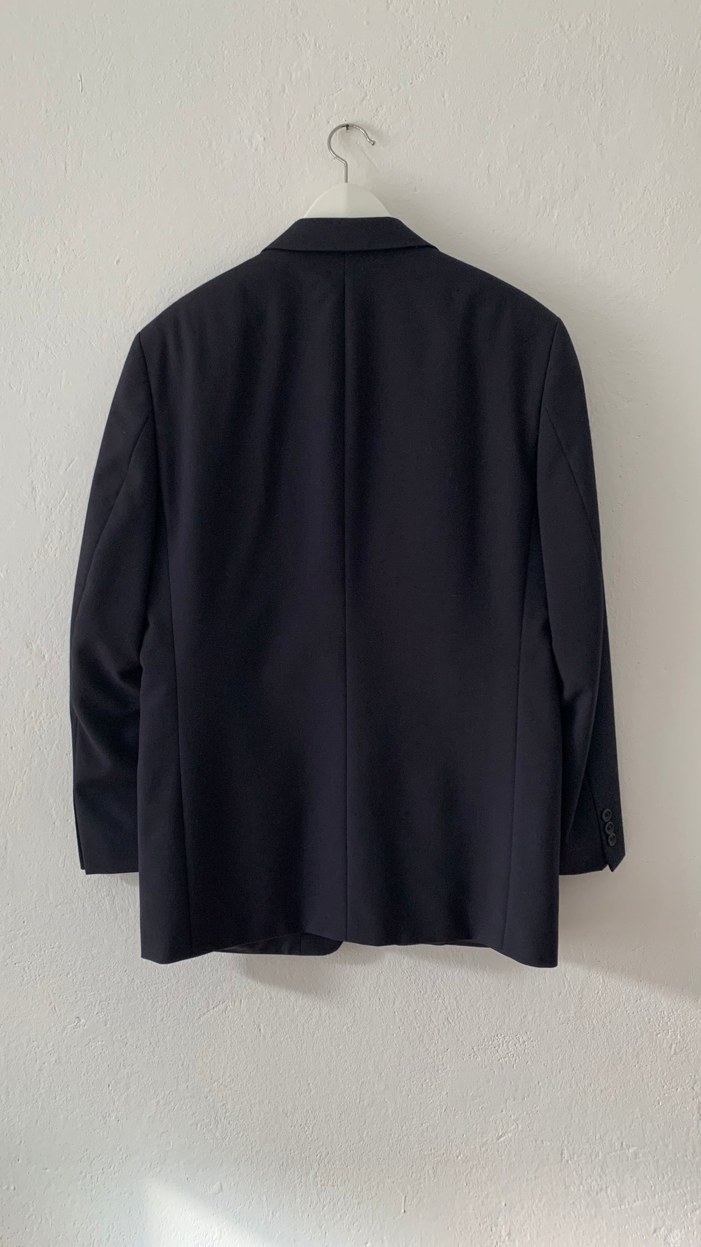 Blazer on hanger from back.