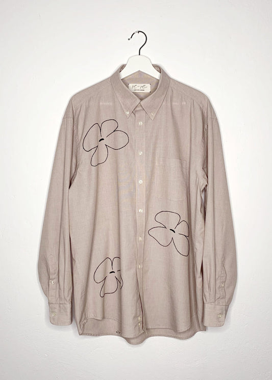 Beige cotton shirt with hand embroidered big black flowers.