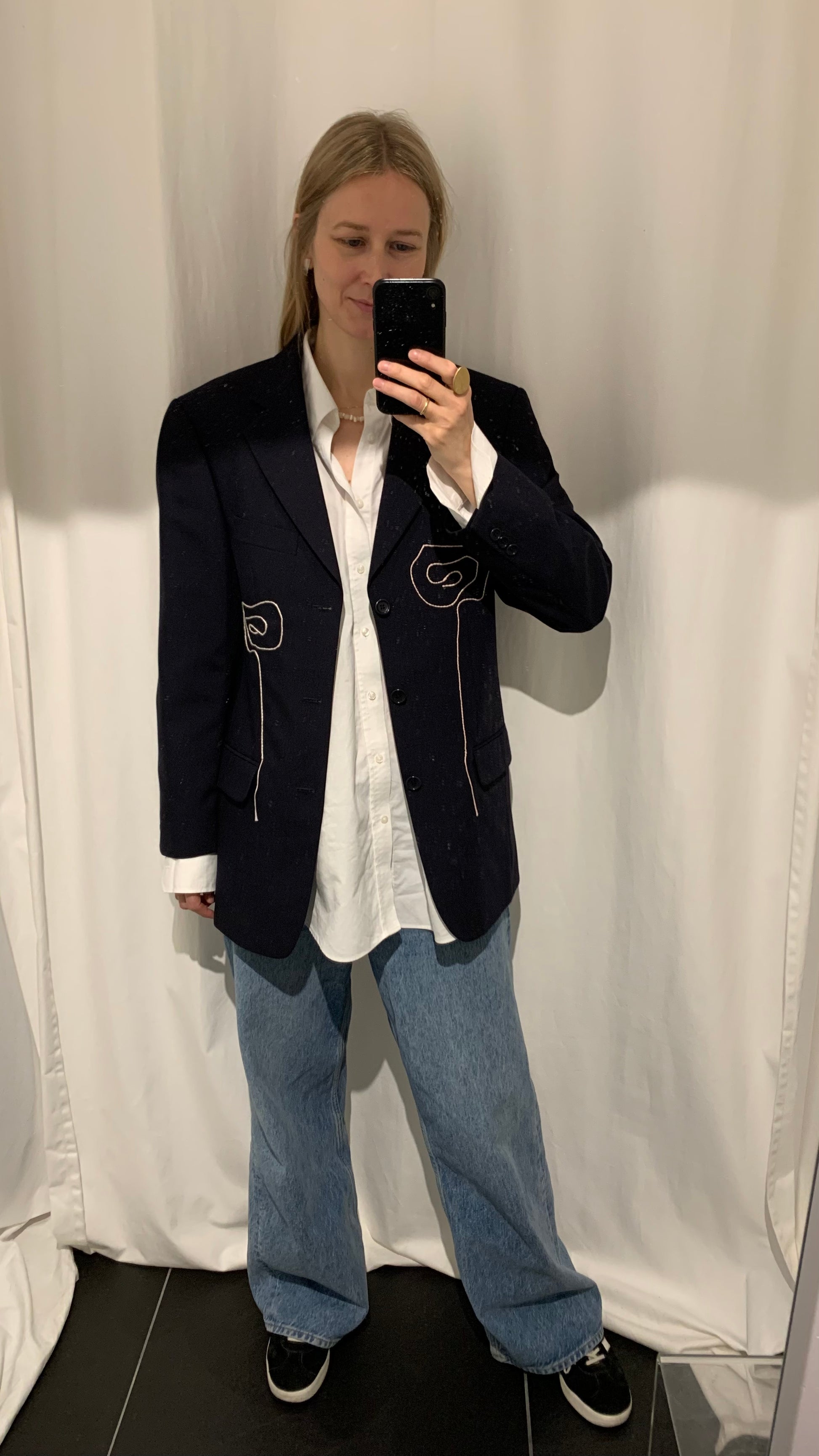 Blazer on person. Styled with denim trousers and a white shirt.